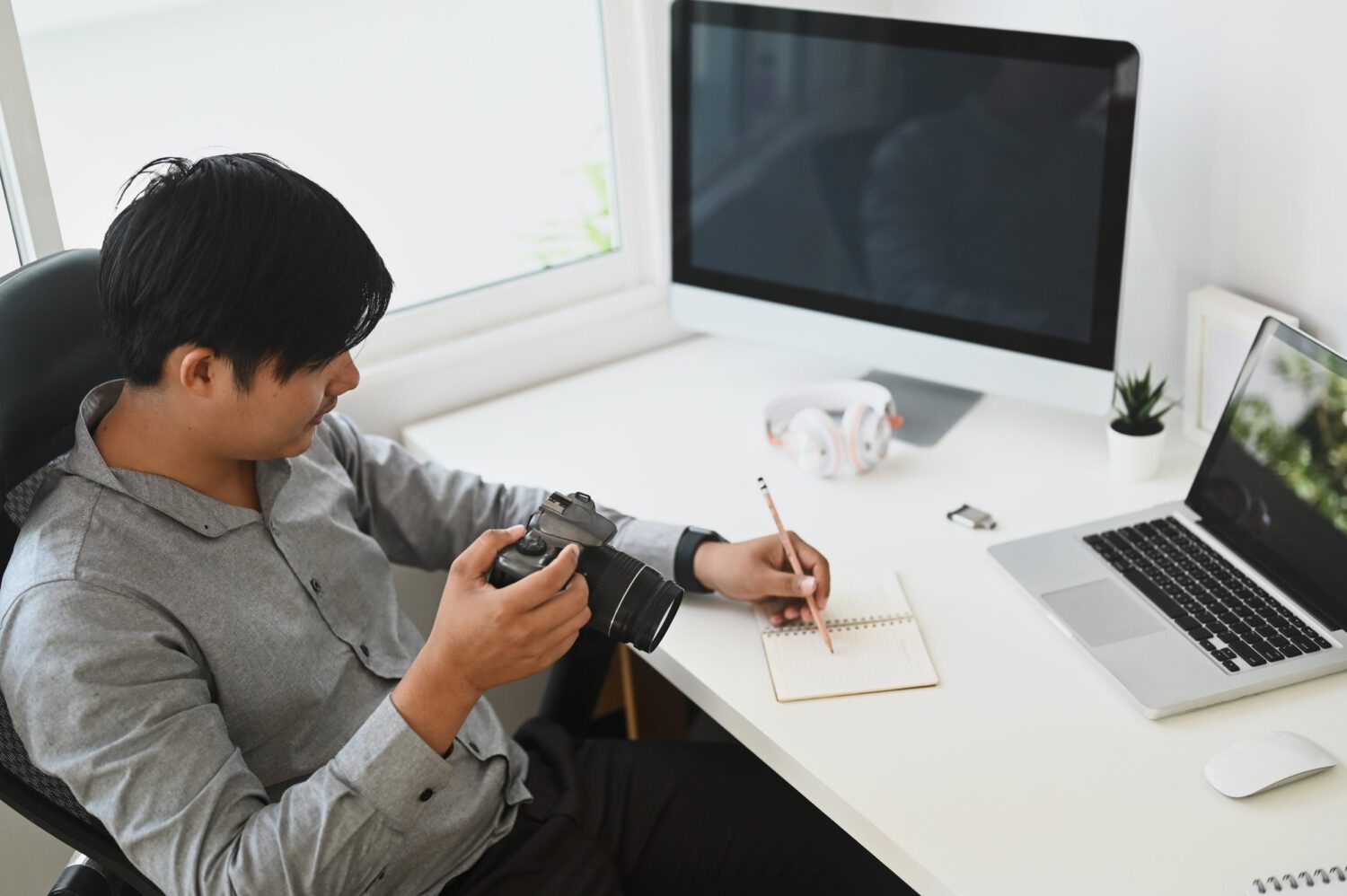 A Young photographer reviewing his captured photos in his camera